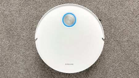 Dreame X60 Max Ultra Complete in white photographed on gray carpet.