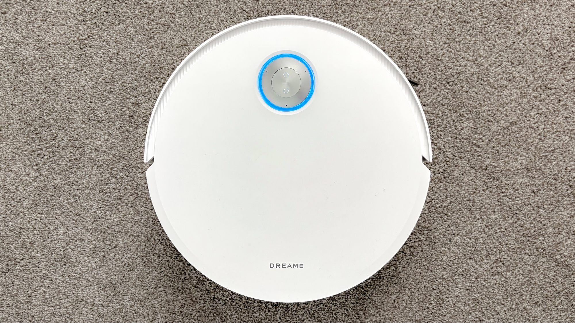 Dreame X60 Max Ultra Complete in white photographed on gray carpet.