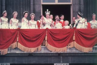 The Queen waving from the balcony at Buckingham Palace at her coronation with Prince Charles, Princess Ann and the Duke of Edinburgh