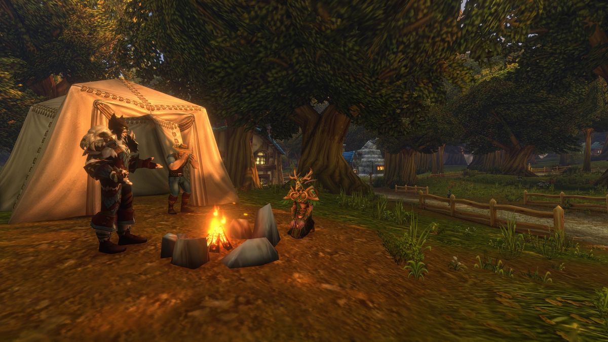 Players gather around a campfire in World of Warcraft: Forever in a forest location