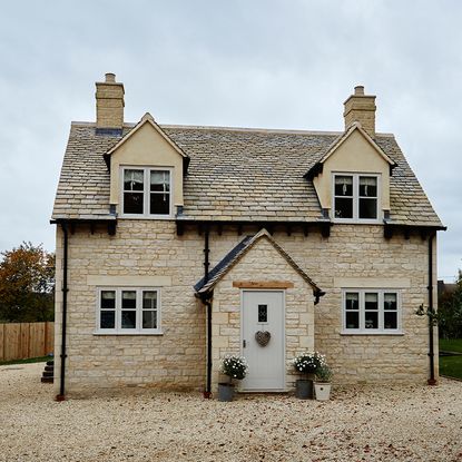 house with sash window and trees