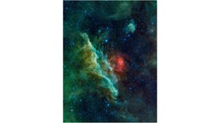 spacecraft photo of a huge green nebula in deep space, with a reddish cloud to its right and lots of bright stars in the background