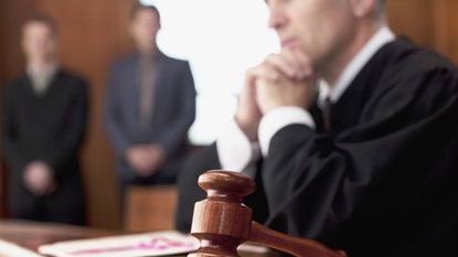 judge with gavel in courtroom