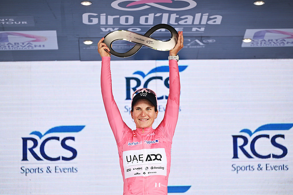 IMOLA, ITALY - JULY 13: Elisa Longo Borghini of Italy and UAE Team ADQ - Pink Leader Jersey celebrates at podium as overall final race winner during the 36th Giro d'Italia Women 2025, Stage 8 a 134km stage from Forli to Imola / #UCIWWT / on July 13, 2025 in Imola, Italy. (Photo by Luc Claessen/Getty Images)