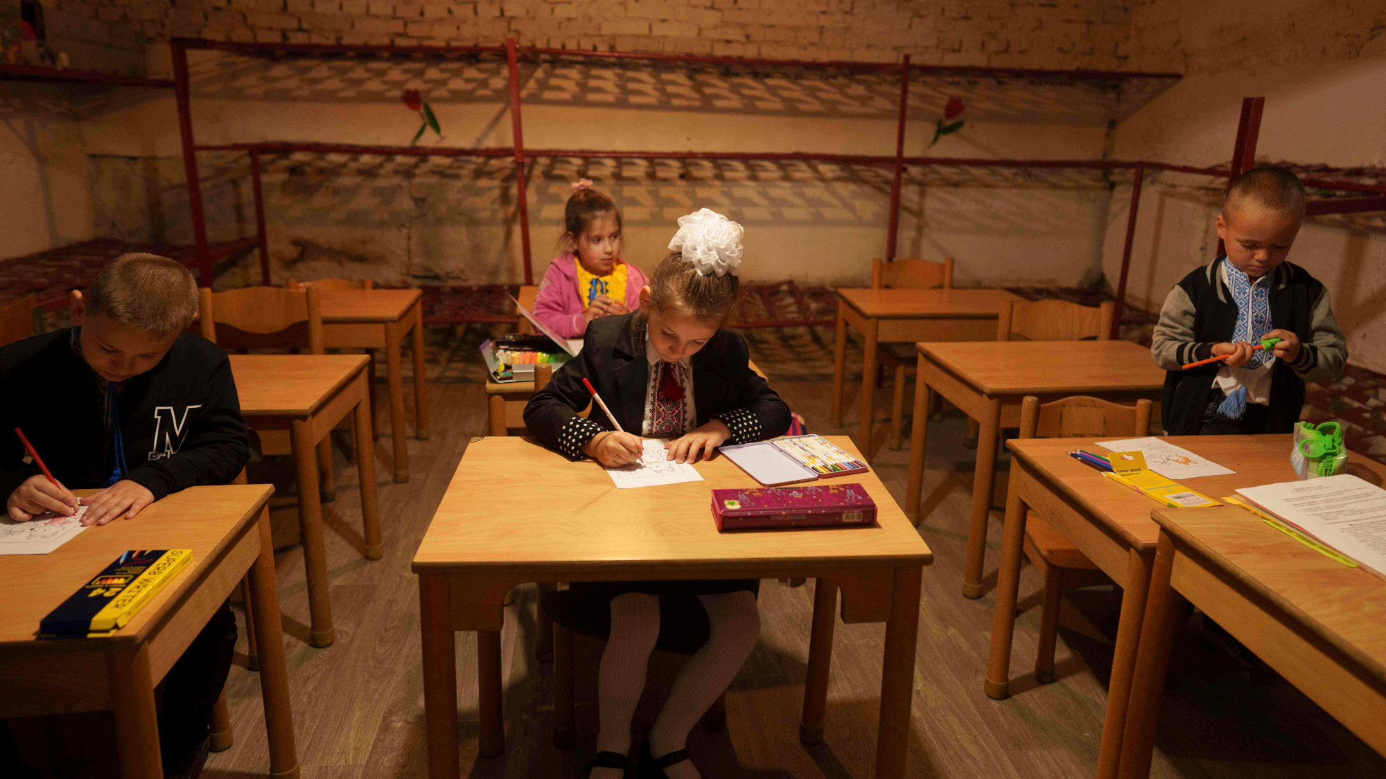 Children sit at their desks