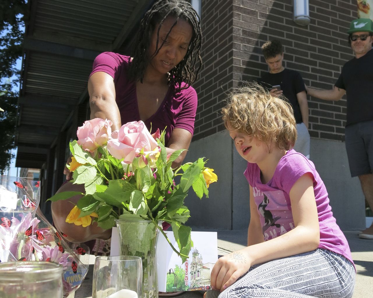 Portlanders at a memorial for two men defending two teenage girls