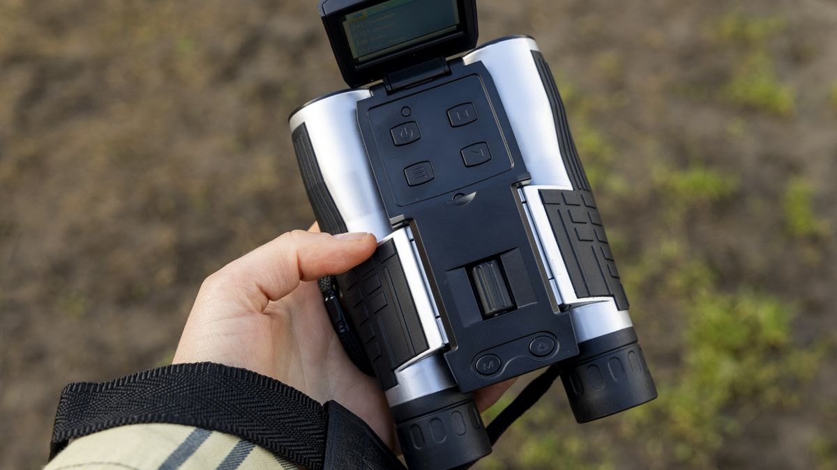 Camonity 12 x 32 digital binoculars in a ladies hand