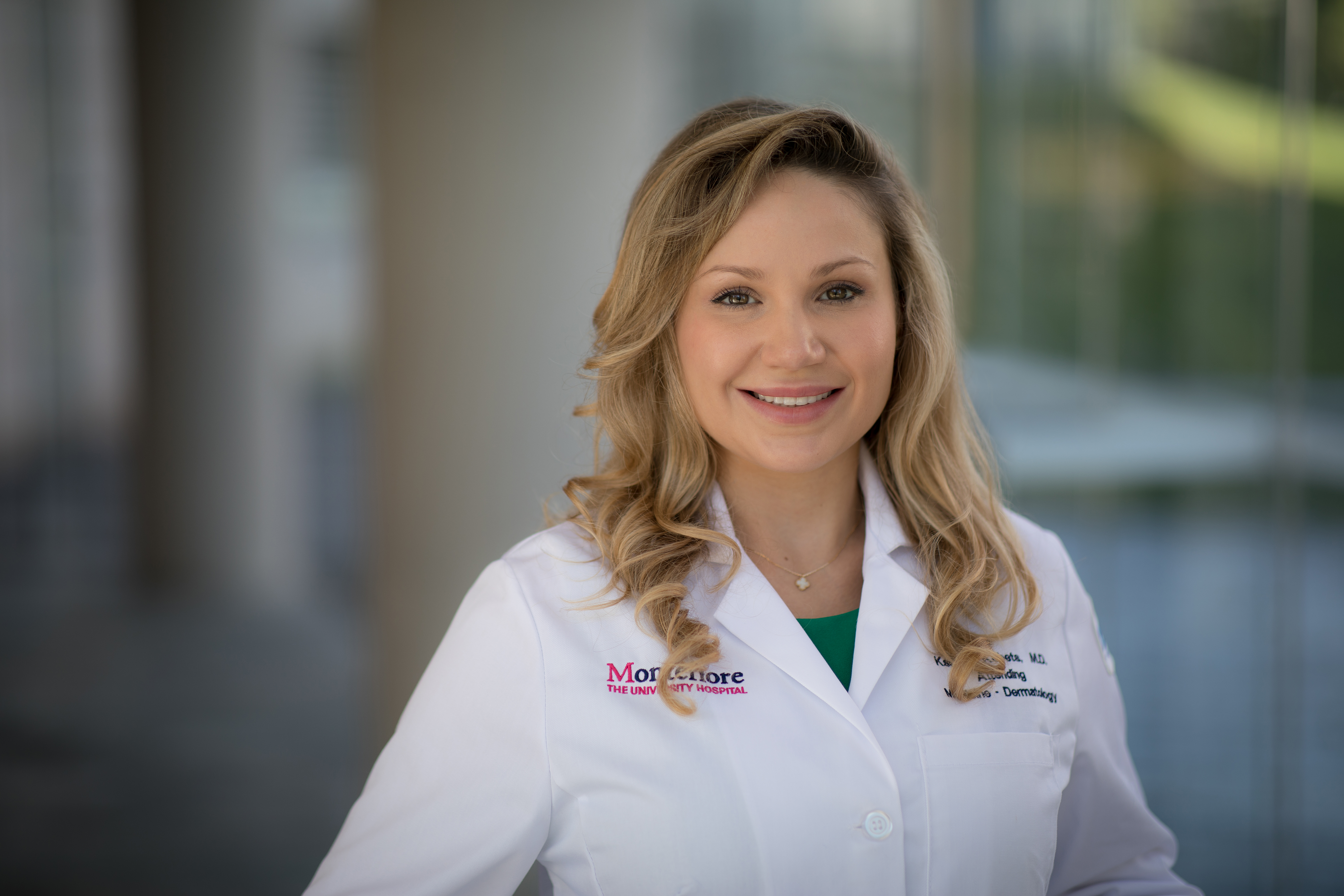 a blonde woman in a white lab coat
