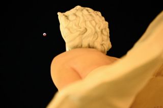 lunar eclipse is seen above the "Forever Marilyn" statue during the Blood Moon Lunar Eclipse in Palm Springs, California