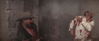 Tector Gorch (Ben Johnson) and Lyle Gorch (Warren Oates) get shot to pieces in