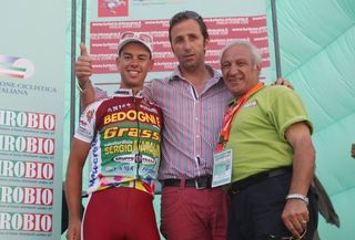 Richie Porte and team director Andrea Tafi enjoy their success on the podium.