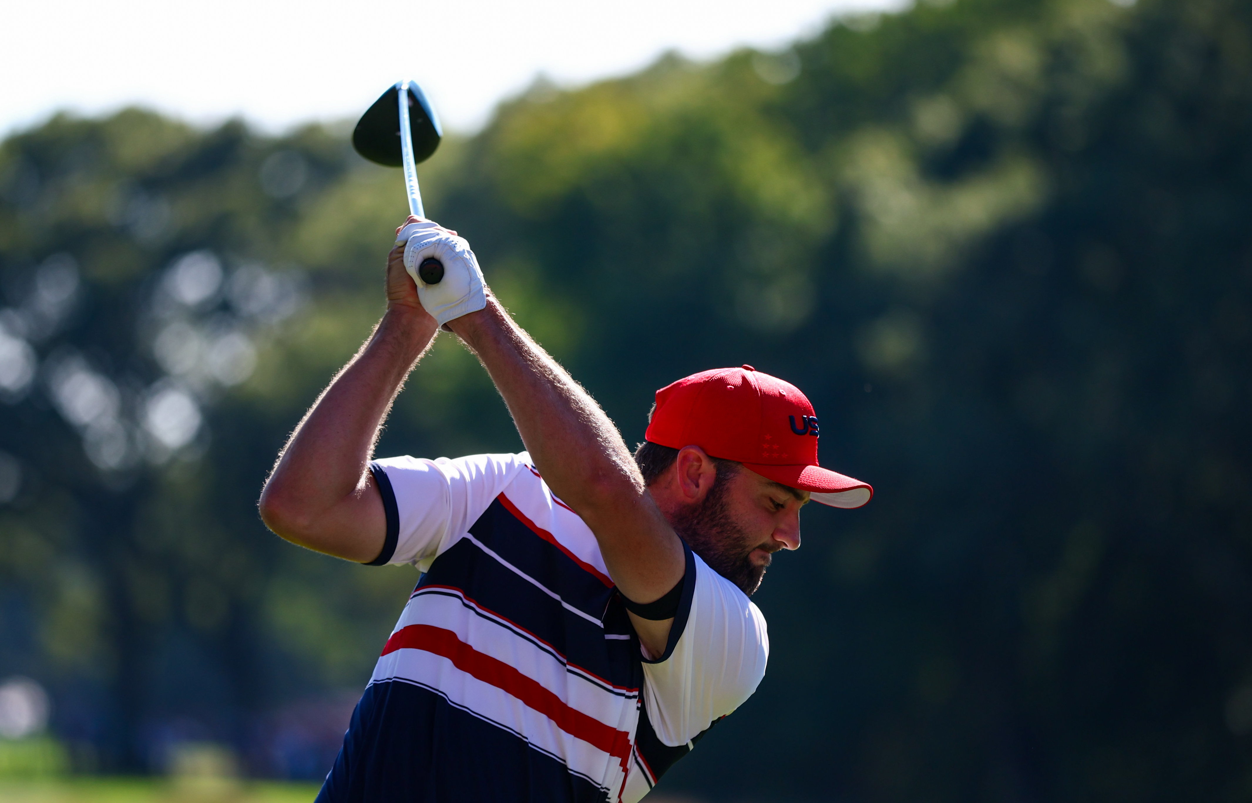 Scottie Scheffler hits a driver