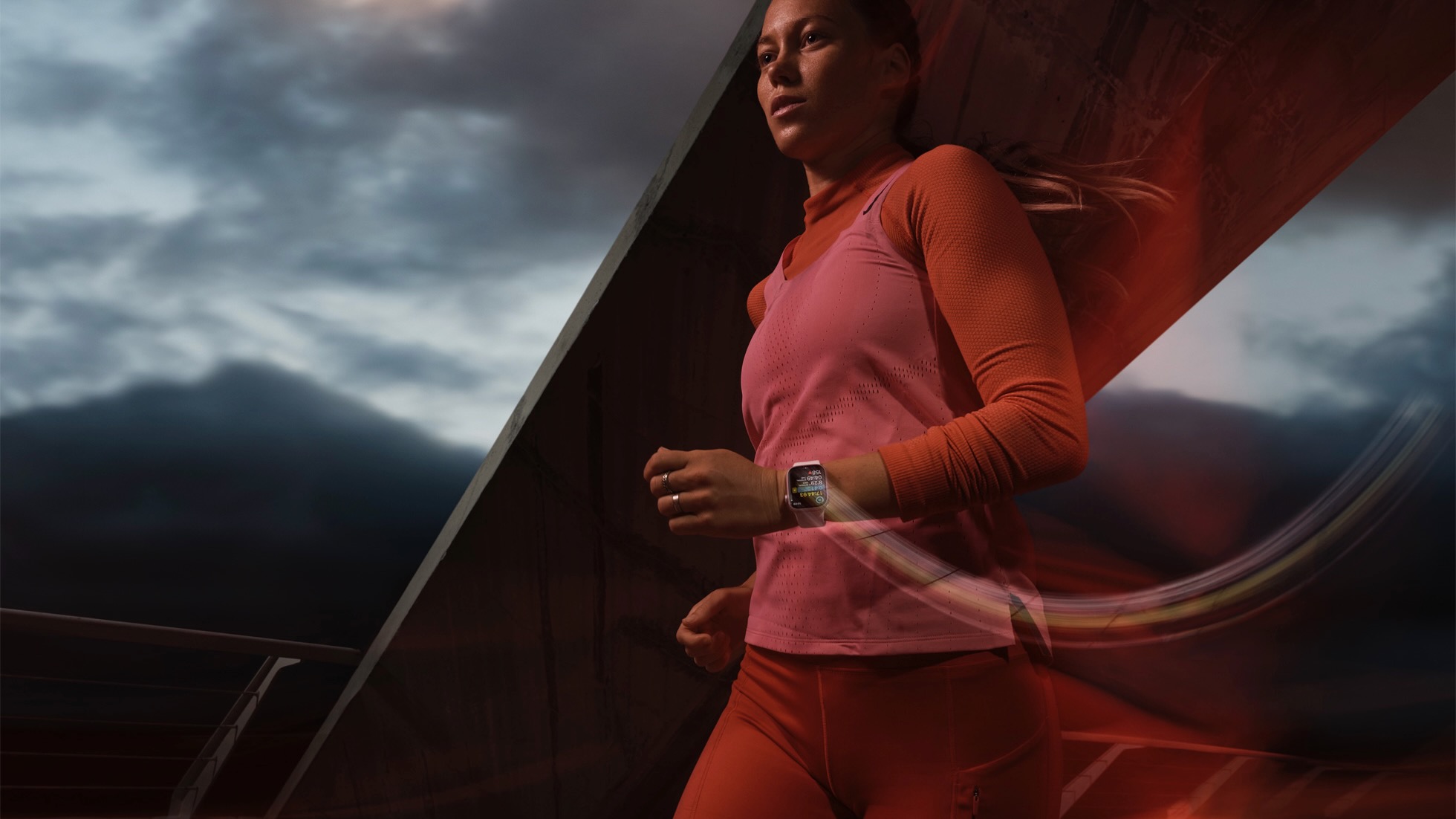 A woman running while wearing the Apple Watch Series 9