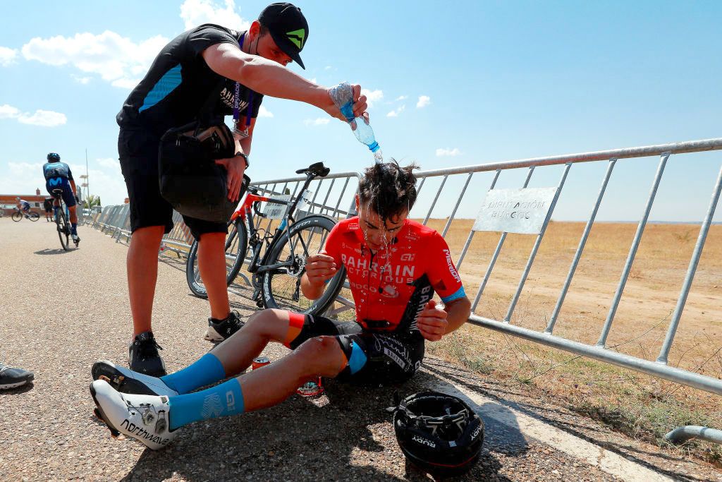 CLUNIA, SPAIN - AUGUST 05: Matevz Govekar of Slovenia and Team Bahrain Victorious celebrates winning and cools down to refresh itself during the 44th Vuelta a Burgos 2022, Stage 4 a 169km stage from Torresandino to Ciudad Romana de Clunia / #VueltaBurgos / on August 05, 2022 in Clunia, Spain. (Photo by Gonzalo Arroyo Moreno/Getty Images)
