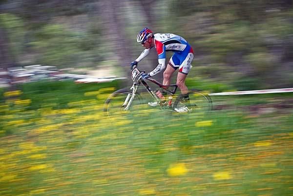 Derek Hermon (Bear Valley Bikes) streaks through the flowers.