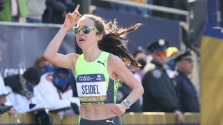 Molly Seidel of the United States crosses the finish line during the 2021 TCS New York City Marathon in Central Park on November 07, 2021