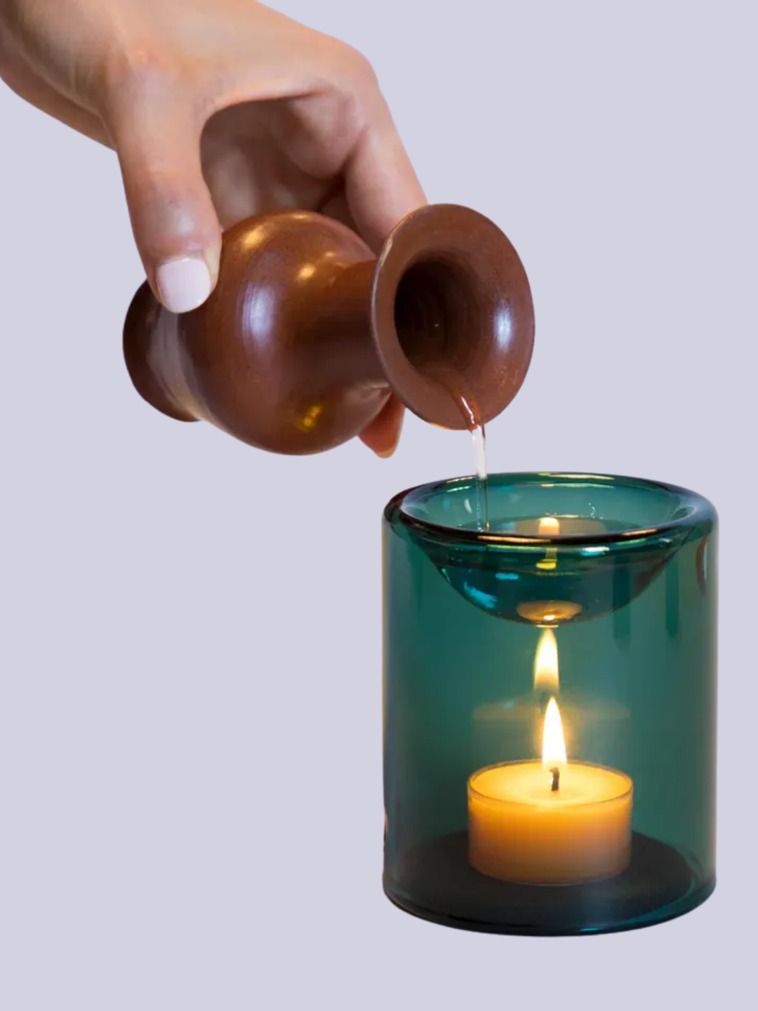 A turquoise glass oil burner
