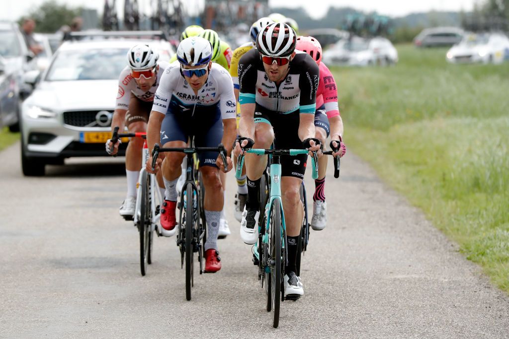 DOKKUM NETHERLANDS AUGUST 30 LR Guillaume Boivin of Canada and Team Israel StartUp Nation and Luke Durbridge of Australia and Team BikeExchange compete in the breakaway during the 17th Benelux Tour 2021 Stage 1 a 1696km stage from Surhuisterveen to Dokkum BeneluxTour on August 30 2021 in Dokkum Netherlands Photo by Bas CzerwinskiGetty Images