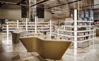 Fragrance section with curved counters and lit shelving