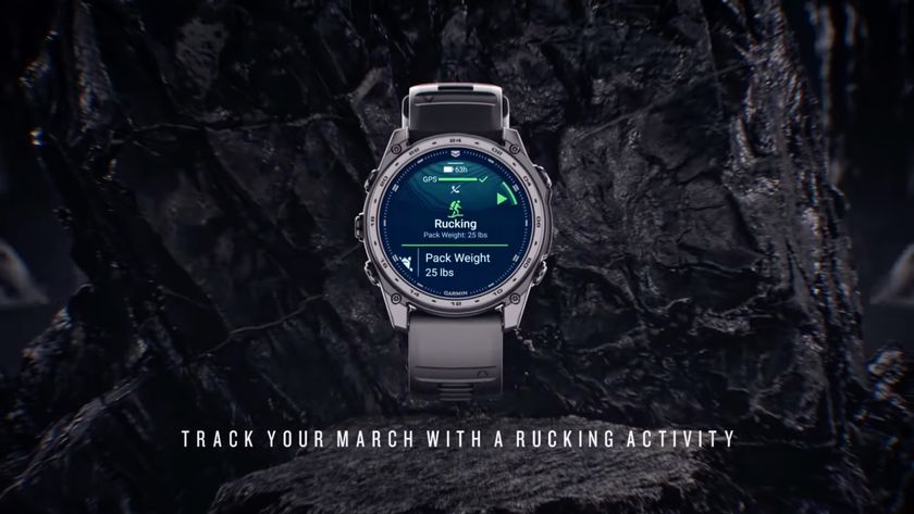 A video still of the Garmin Tactix 8 unveiling, showing a Rucking activity on the start screen with &quot;Pack Weight: 25 lbs.&quot; underneath. Under the watch, the words &quot;track your march with a rucking activity&quot; are superimposed over a rocky background.