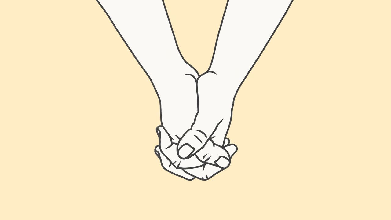 Concept of two people holding hands, representing assisted dying vote 