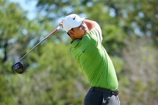 Tom Kim hits his tee shot with a driver