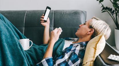 Sick woman using a phone