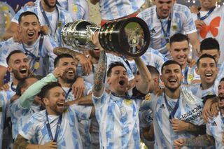 Lionel Messi and his Argentina team-mates celebrate after beating Brazil to win the Copa America in July 2021.