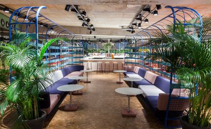 Caged seating area at Kantini in Bikini Berlin, designed by Studio Aisslinger