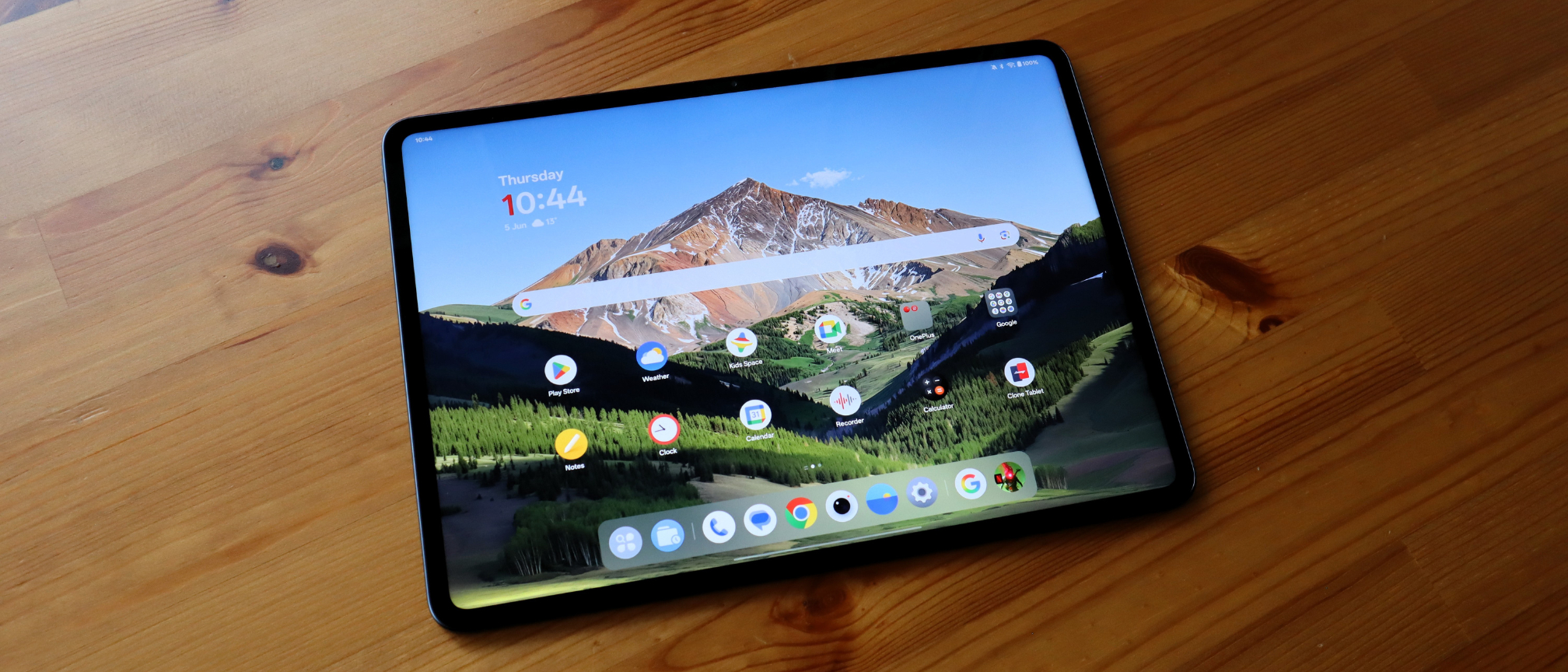 OnePlus Pad 3 lying on a wooden table