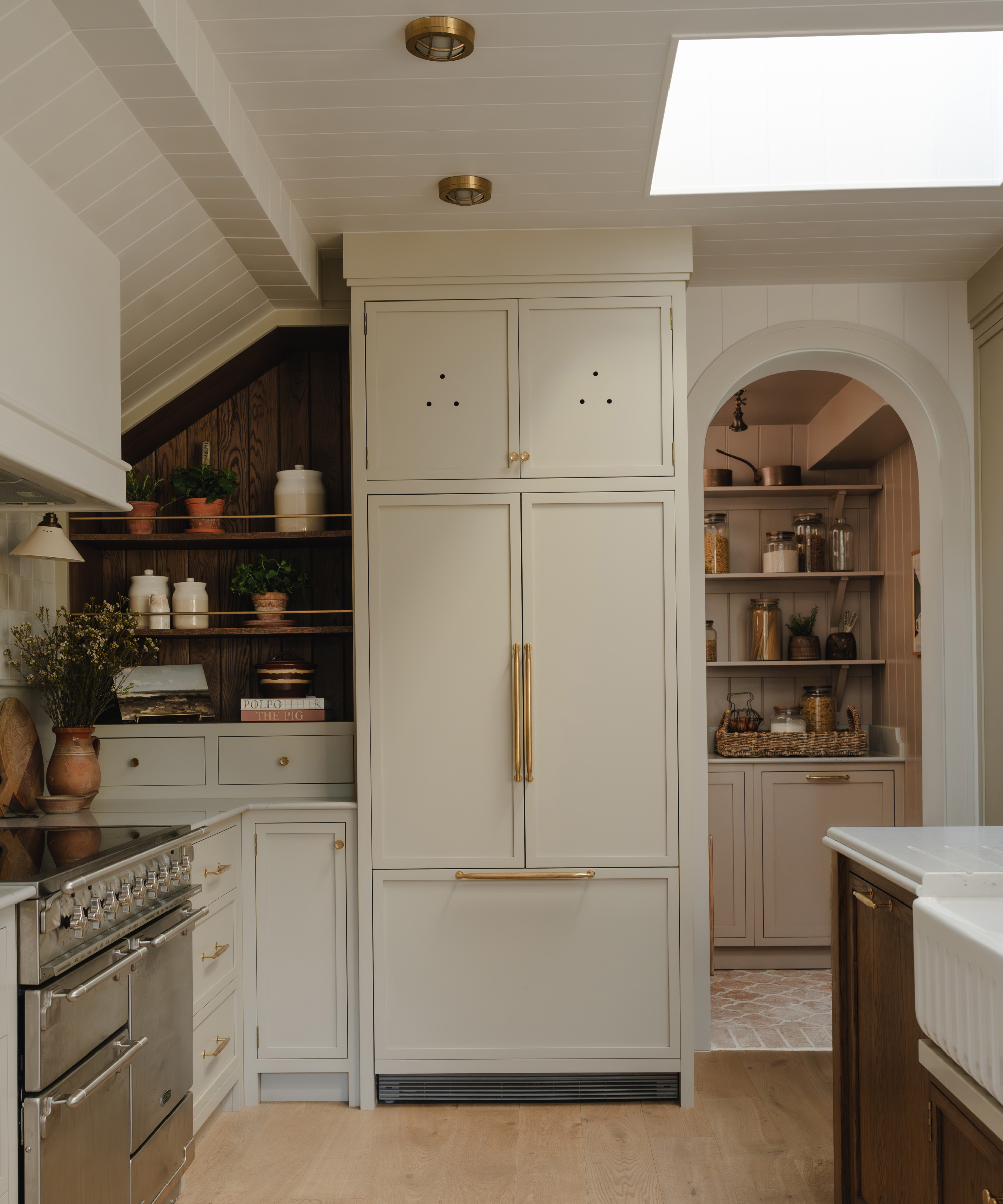 pantry through open arch in kitchen