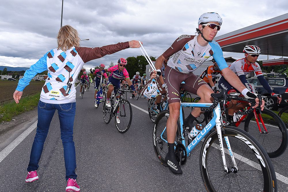 Jesse Sergent grabs a mussette during stage 4 at Tour de Suisse.
