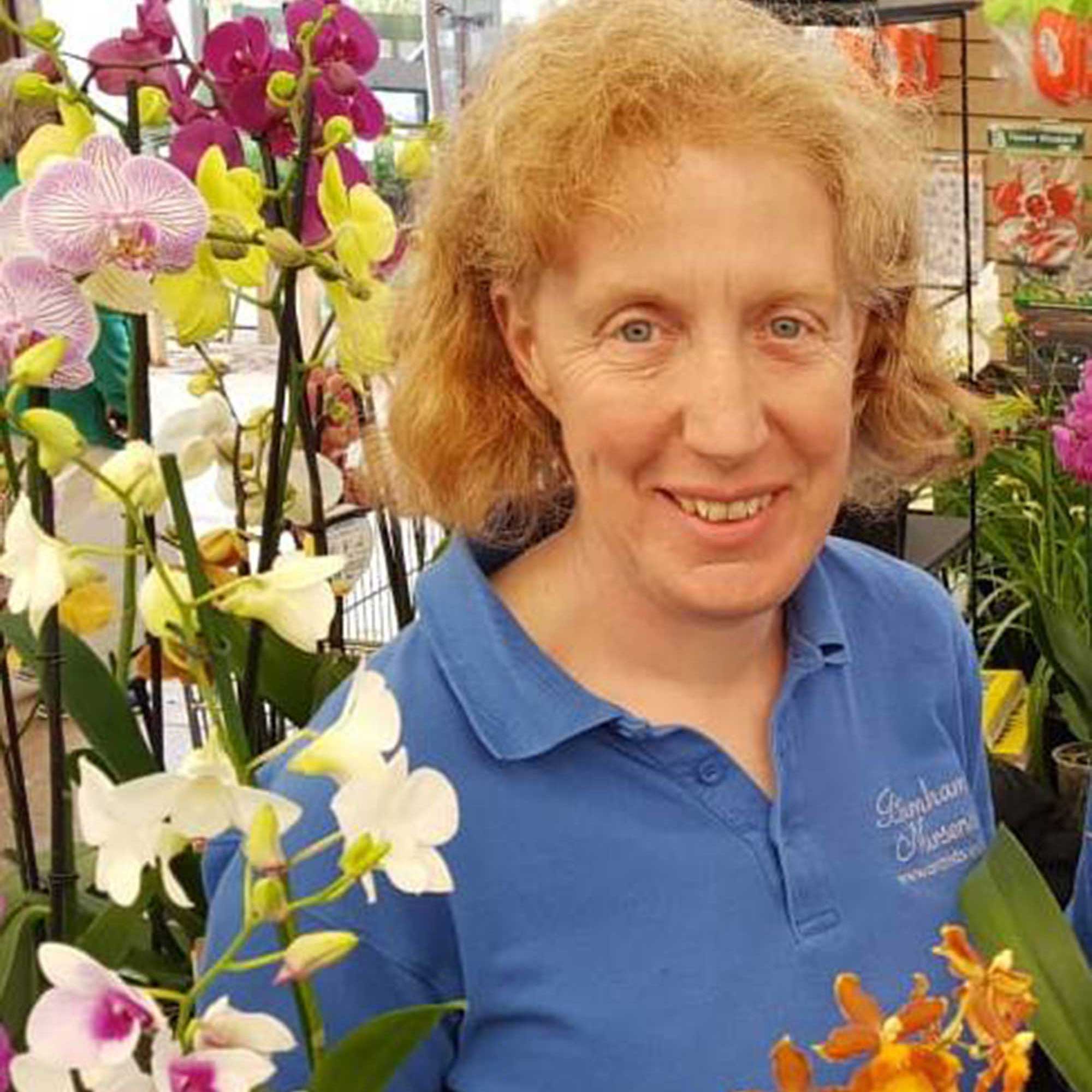 Sara Ritterhausen profile photo with orchids