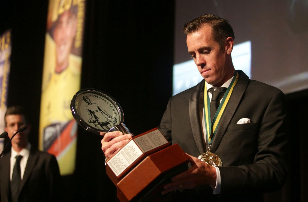 May Hayman checks the Oppy trophy over