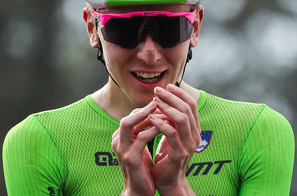Slovenian rider Tadej Pogacar celebrates after winning the men&#039;s Elite road race cycling event during the UCI 2025 Road World Championships, in Kigali, on September 28, 2025. (Photo by Anne-Christine POUJOULAT / AFP)