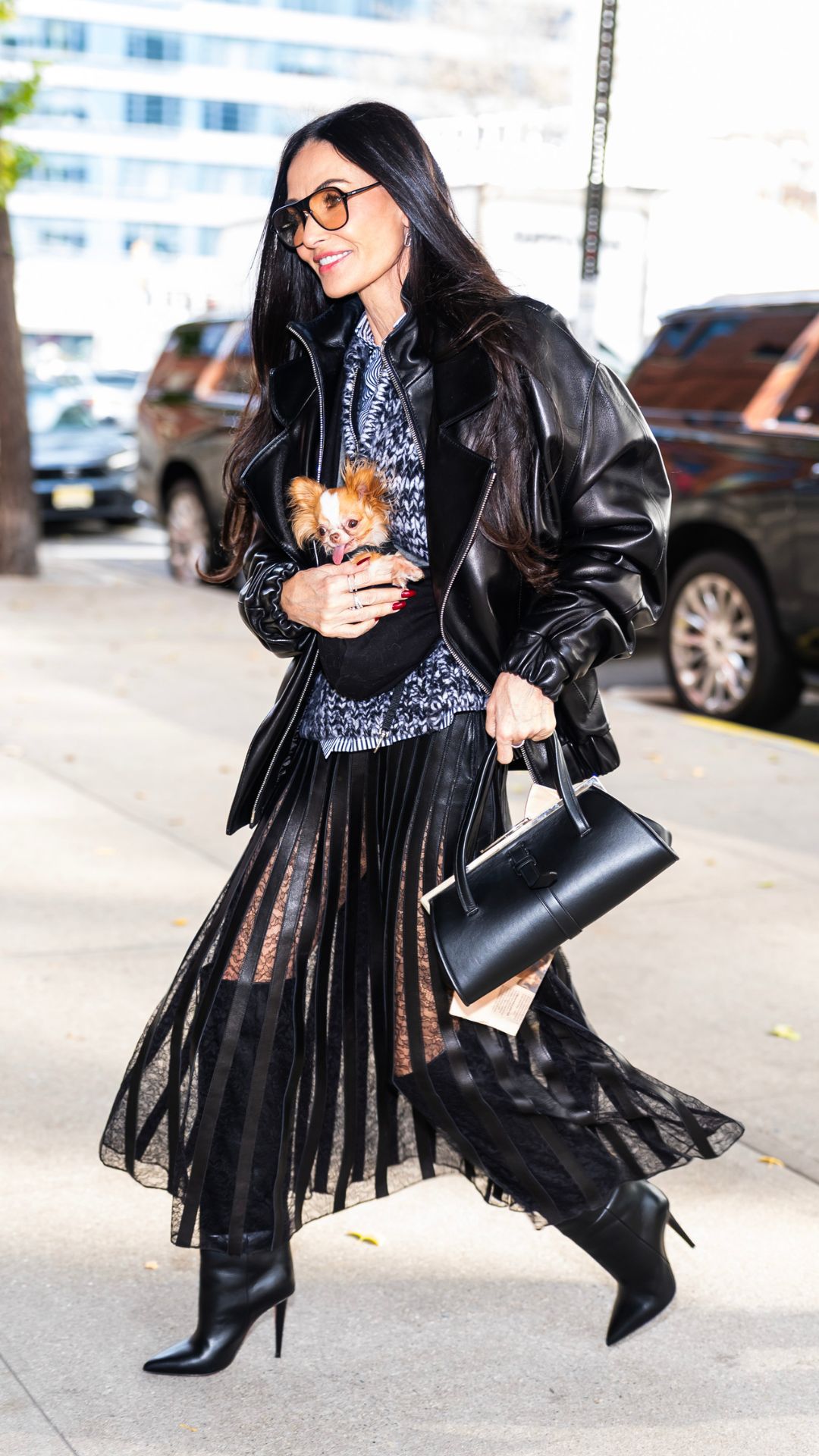 demi moore wearing a leather jacket and sheer skirt