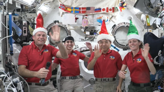 Four Expedition 70 astronauts send holiday wishes to Earth for Christmas 2023.