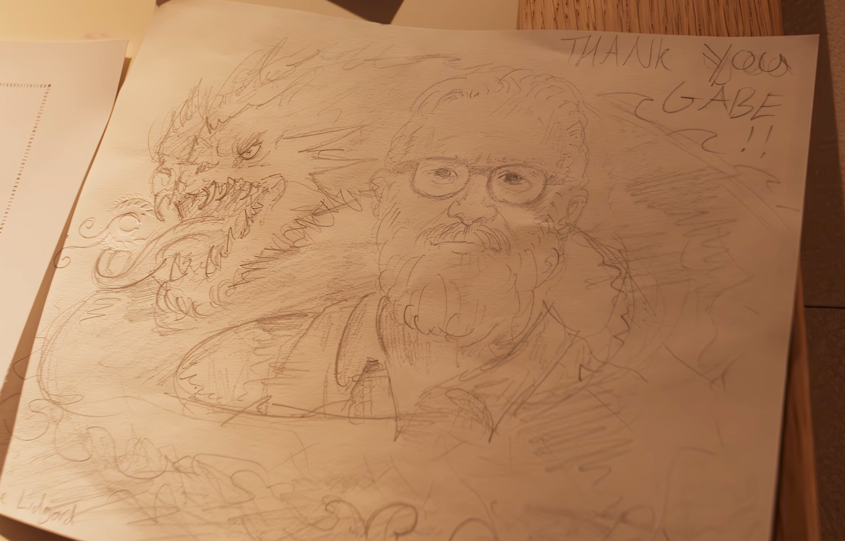 Pencil sketch of Gabe Newell and a leviathan, and the words 