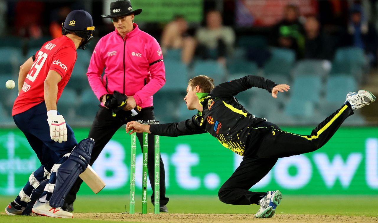 Australia&#039;s Adam Zampa dives in an attempt to catch the ball during the second cricket match of the Twenty20 series between Australia and England at Manuka Oval in Canberra on October 12, 2022