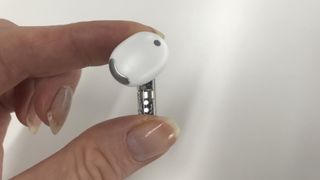 Nothing Ear (Stick) left earbud held in hand