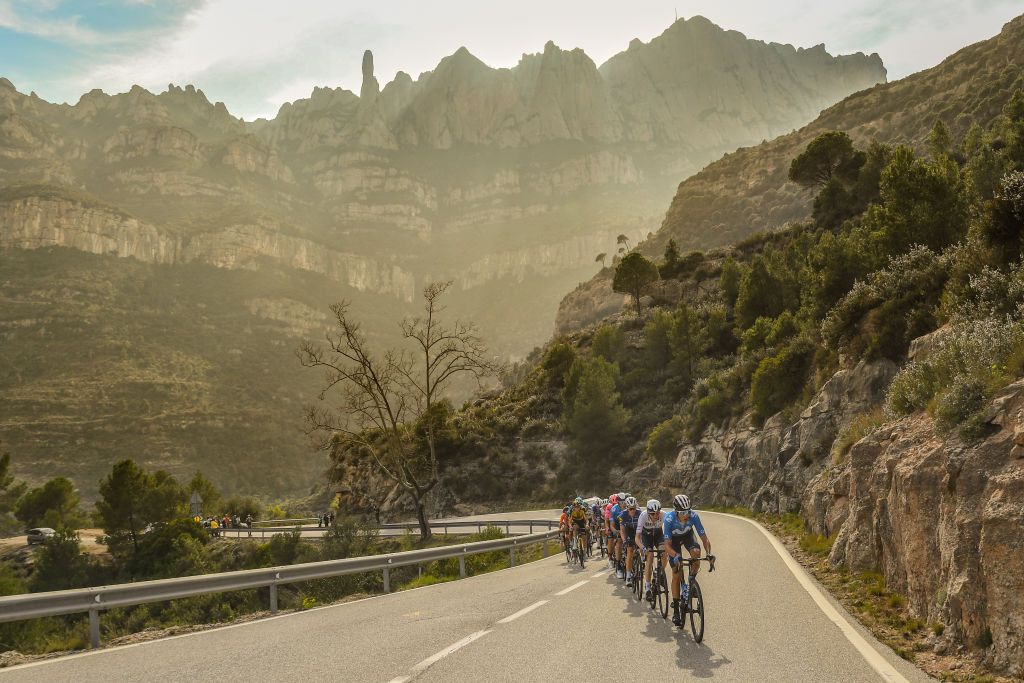 MANRESA SPAIN MARCH 26 James Knox of United Kingdom and Team Deceuninck QuickStep Rmi Cavagna of France and Team Deceuninck QuickStep Marc Soler Gimenez of Spain and Movistar Team David De La Cruz Melgarejo of Spain and UAE Team Emirates Thymen Arensman of Netherlands and Team DSM Ide Schelling of Netherlands and Team BORA Hansgrohe Attila Valter of Hungary and Team Groupama FDJ Matej Mohoric of Slovenia and Team Bahrain Victorious Bob Jungels of Luxembourg and Ag2R Citroen Team Omer Goldstein of Israel and Team Israel StartUp Nation during the 100th Volta Ciclista a Catalunya 2021 Stage 5 a 2015km stage from La Pobla De Segur to Manresa 220m Breakaway Port de Montserrat 635m Mountains Landscape VoltaCatalunya100 on March 26 2021 in Manresa Spain Photo by David RamosGetty Images