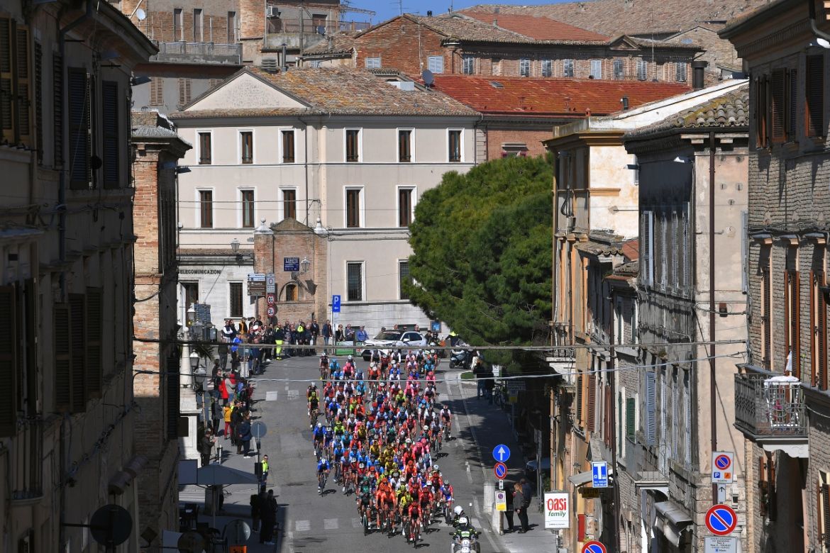 The peloton makes its way through a town en route to the finish in Recanati