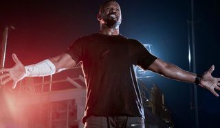 Project Power Jamie Foxx stands arms open on the deck of The Genesis