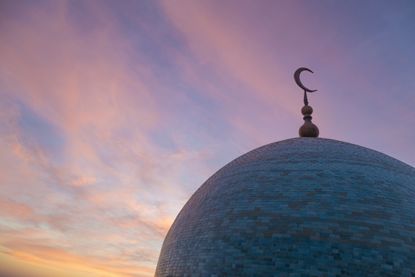 The dome of a mosque at dusk