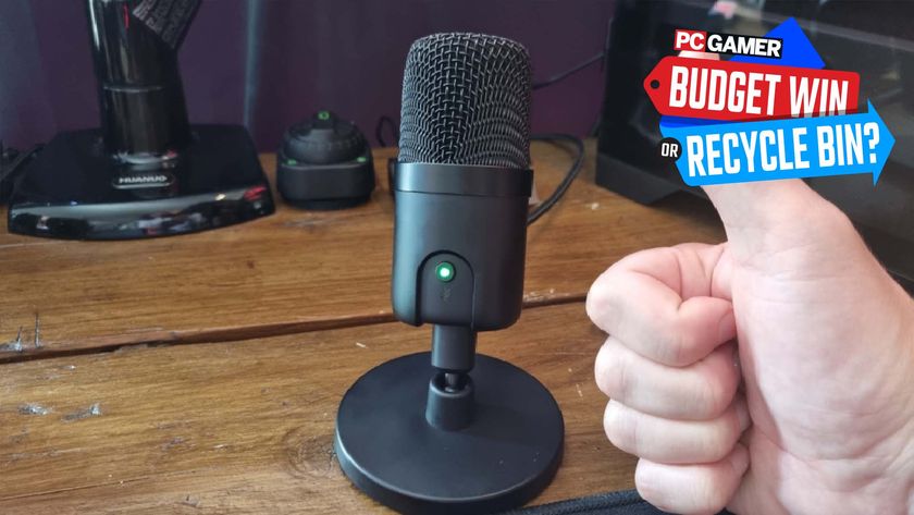 Amazon Basics gaming microphone on a wooden desktop