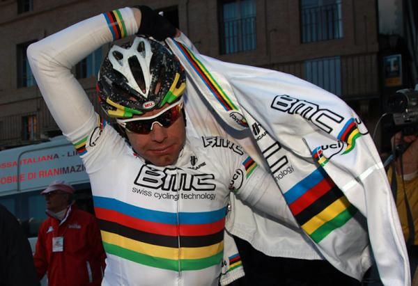World champion Cadel Evans grabs a jacket after the finish.