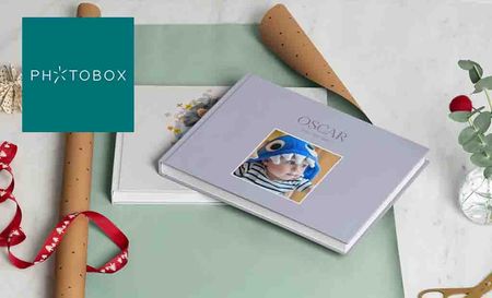 photobox logo top left with two baby pictures books