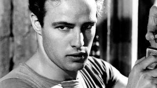 Marlon Brando holds a deck of cards in A Streetcar Named Desire