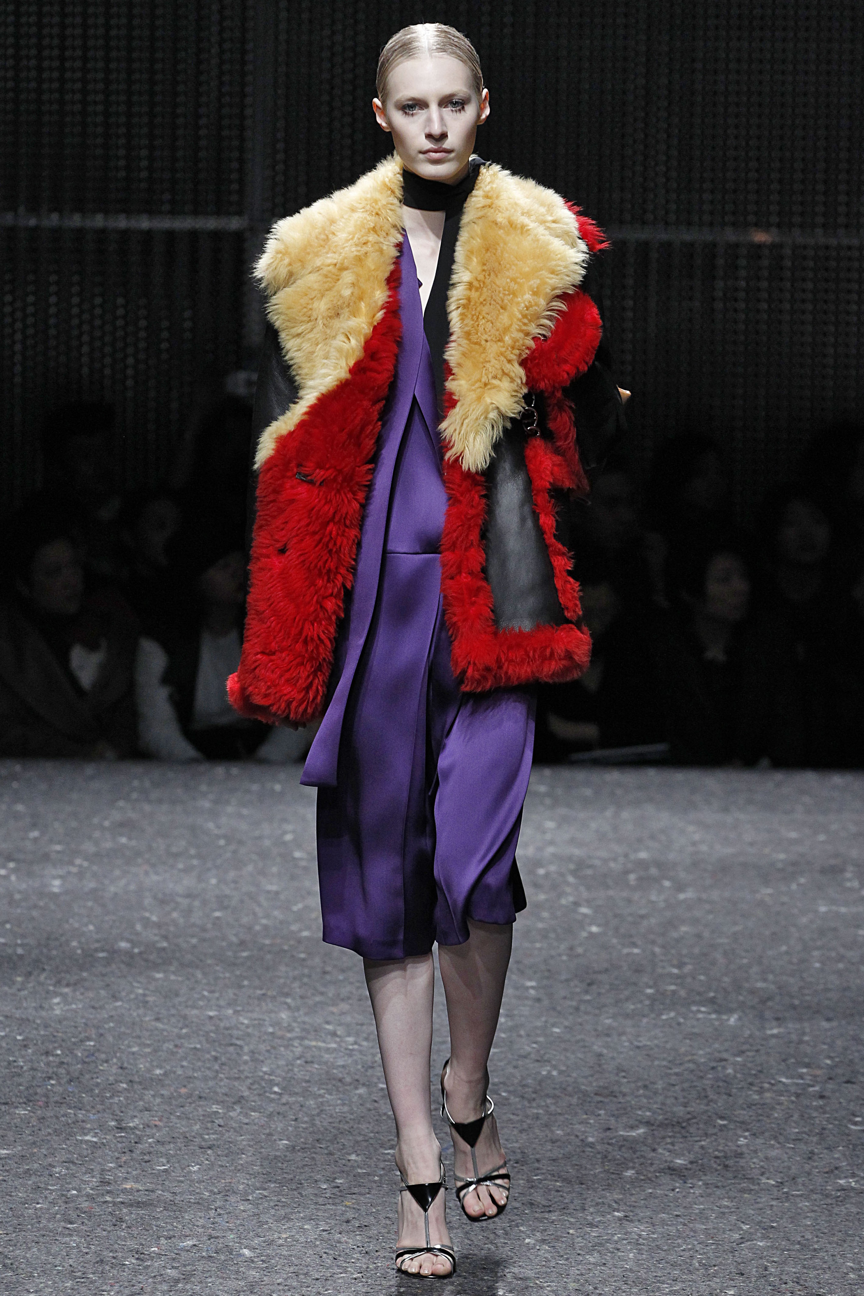 A model wearing Rihanna and Chase Sui Wonders Prada coat on the Fall 2014 runway