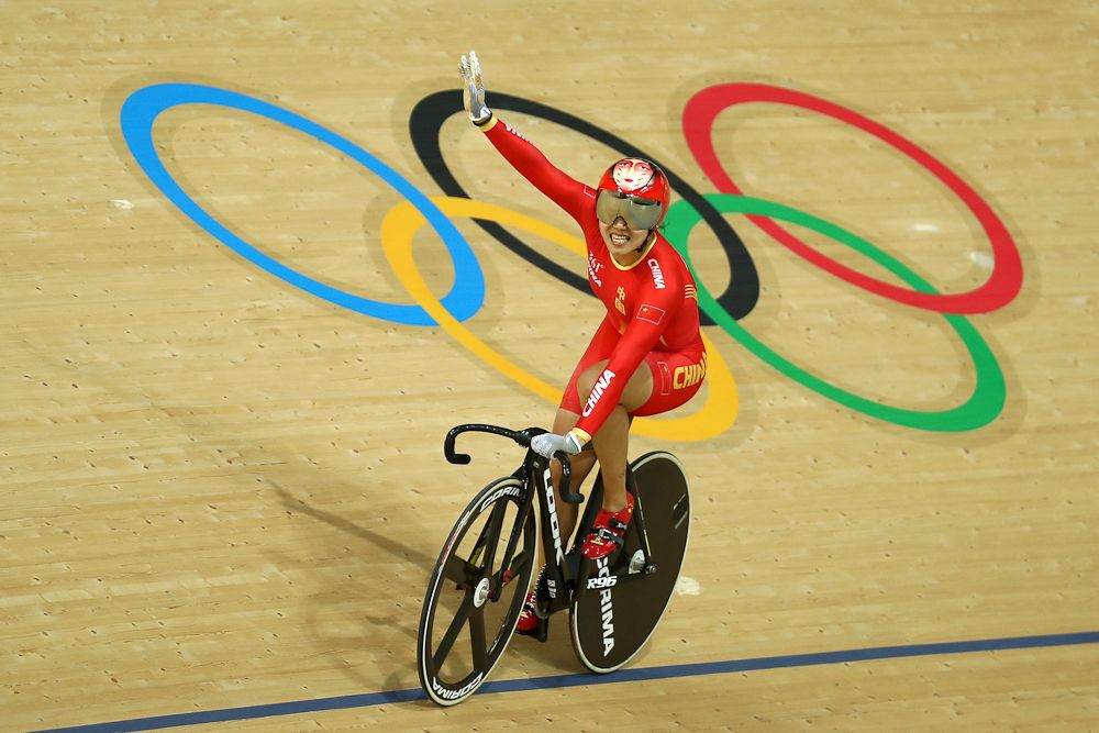 China's Zhong Tianshi celebrates after winning gold in the women's Team Sprint